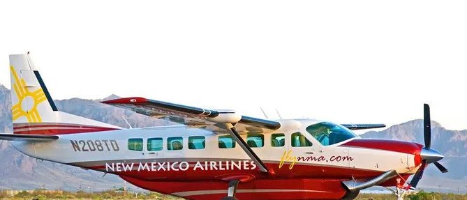 New Mexico Airlines Cessna Grand Caravan N208TD with mountains behind