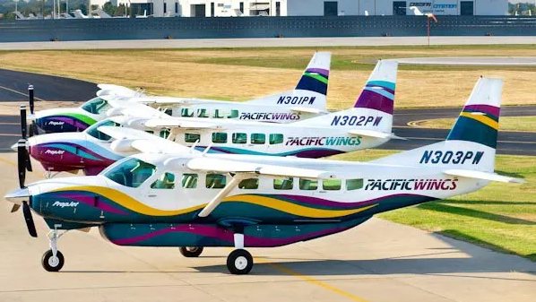 Three Pacific Wings Cessna Grand Caravans, N301PW, N302PW and N303PW, parked in a row